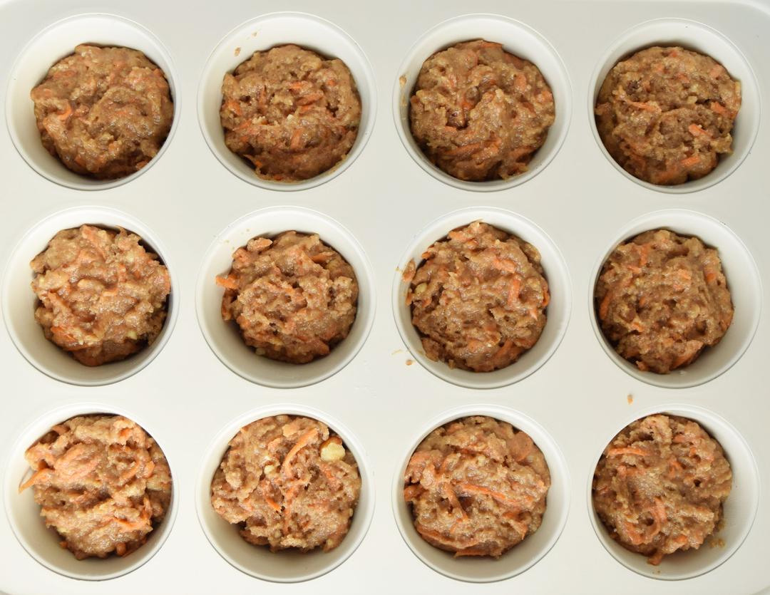 unbaked carrot cupcakes in muffin pan