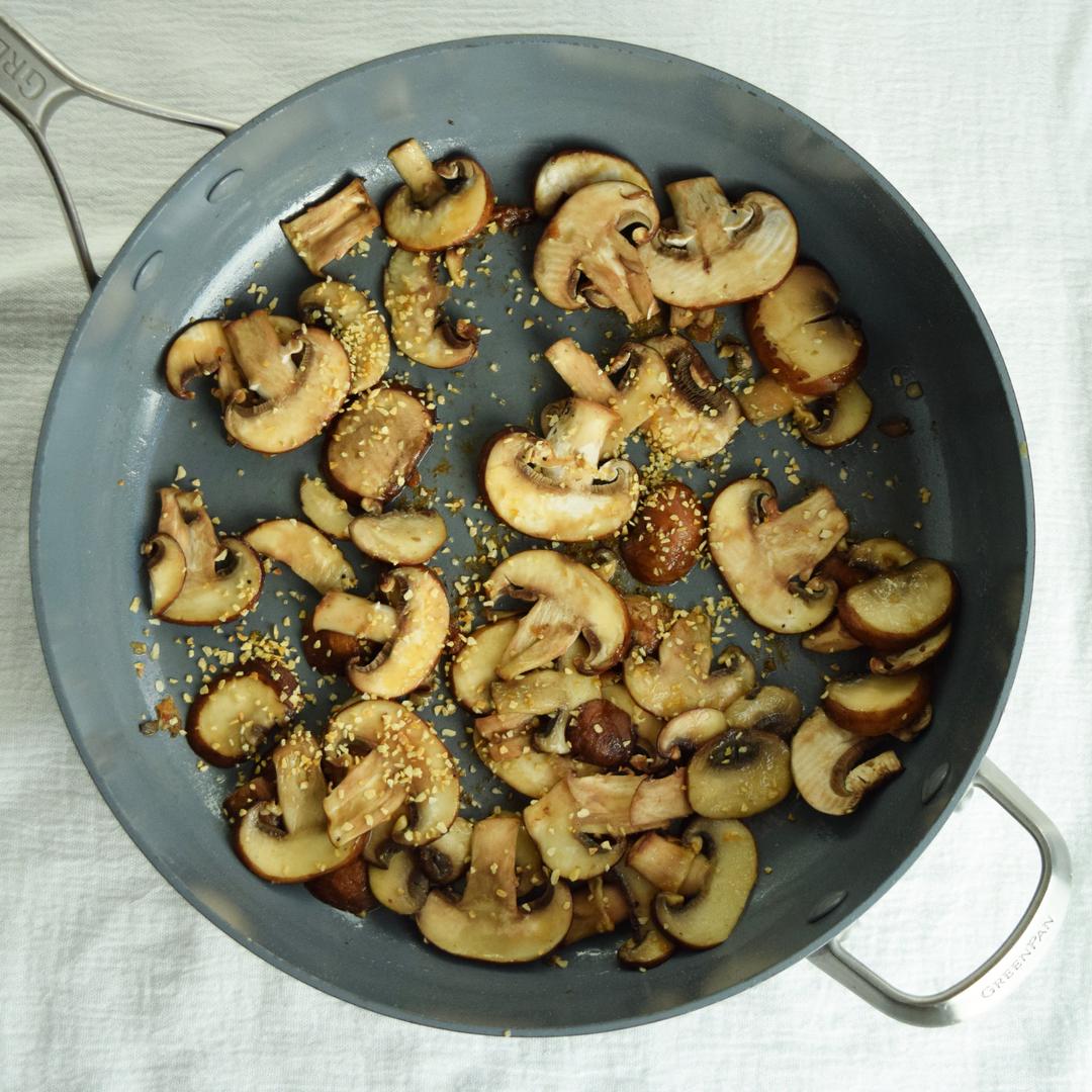 mushrooms and garlic in saute pan