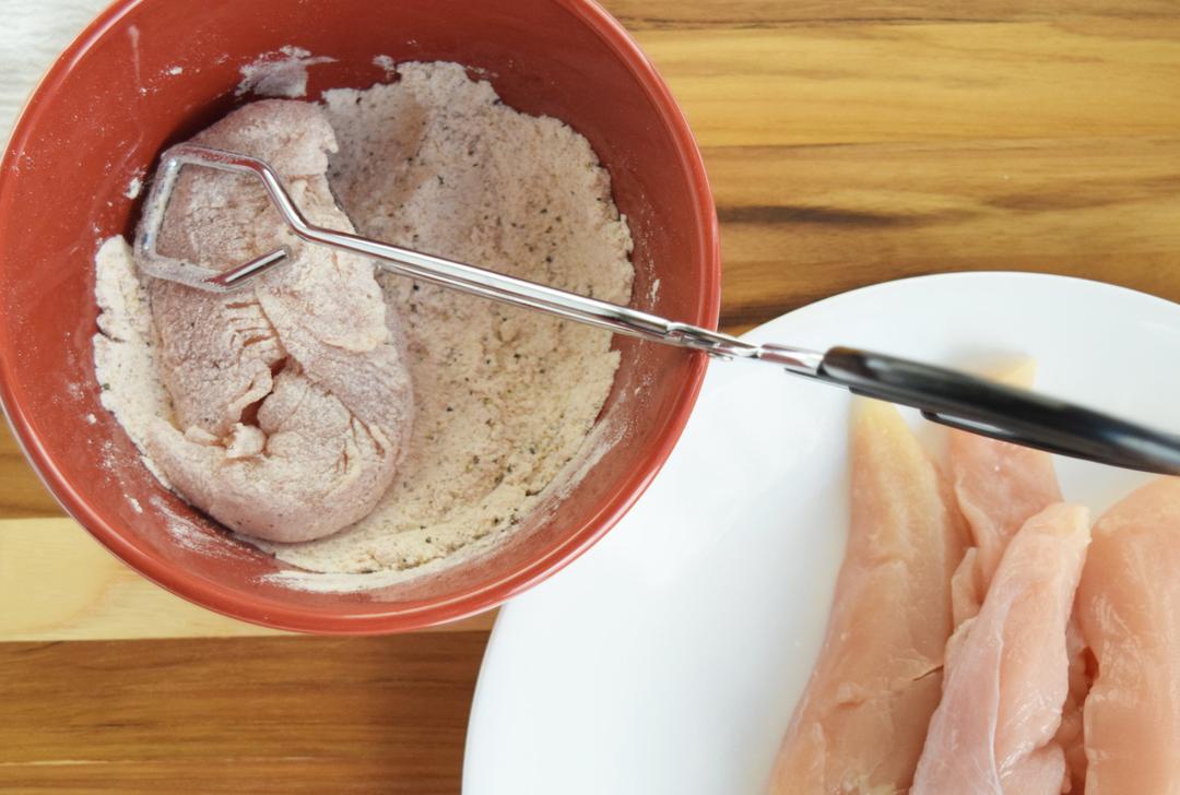 raw chicken and bowl of flour for dredging