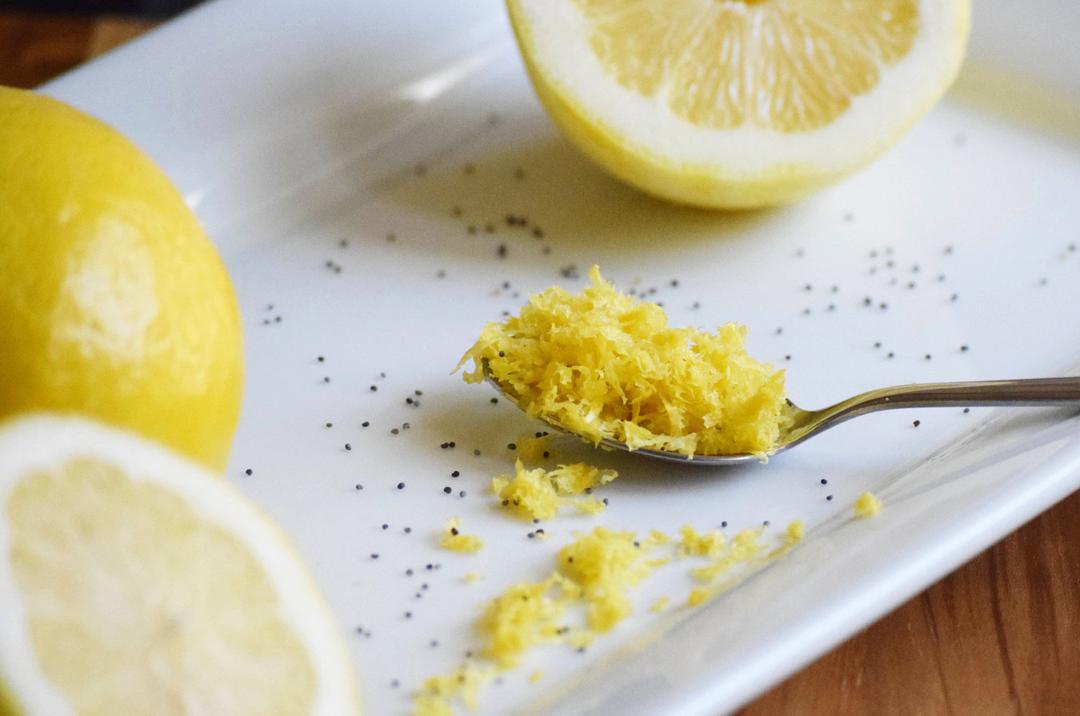 a spoonful of lemon zest surrounded by lemons