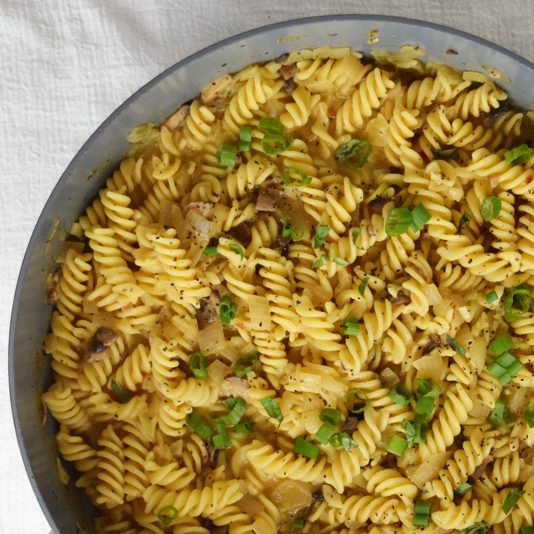 Sprinkle Green Onions onto Pasta Meal