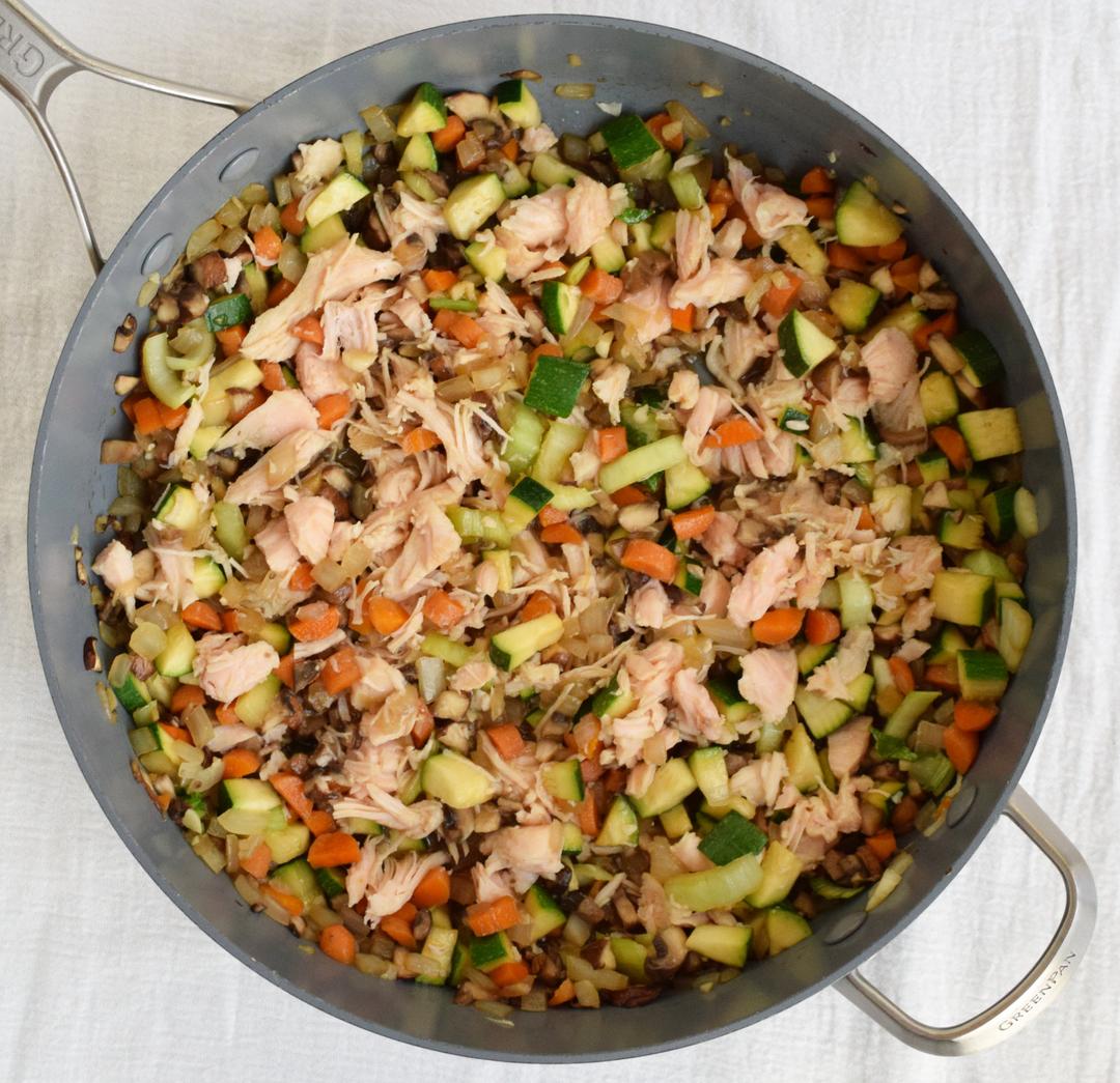 vegetables in a saute pan mixed with tamari, oyster sauce, and canned chicken