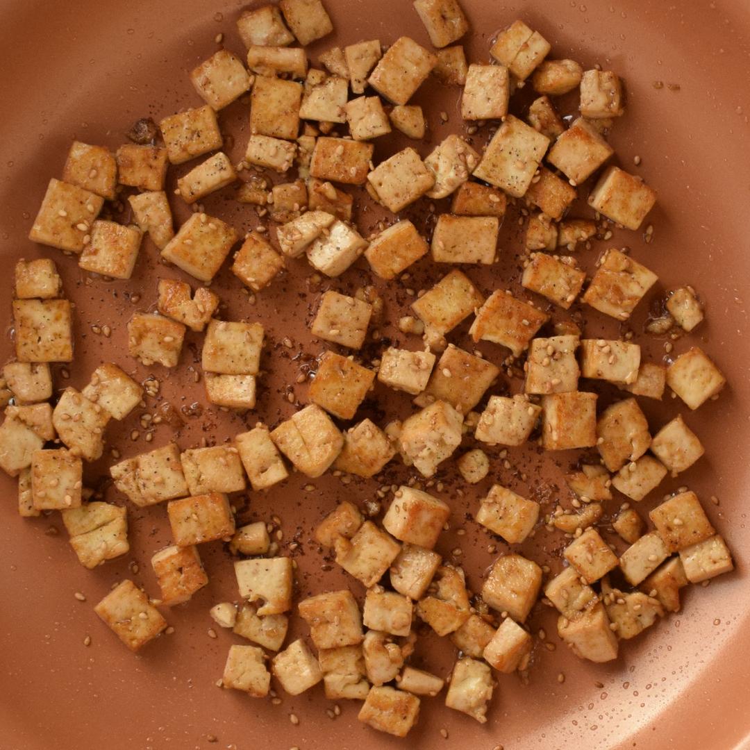 marinated tofu fried in a saute pan