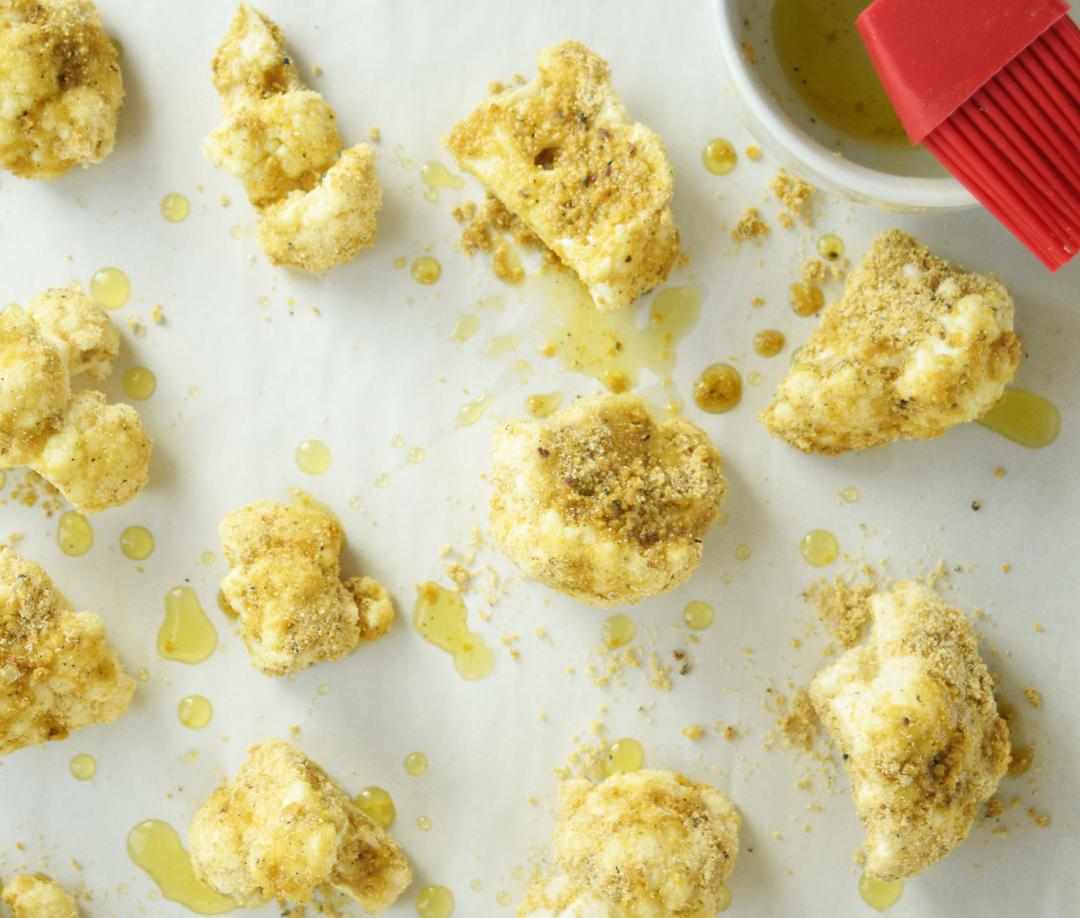 Drizzle Olive Oil dredge cauliflower florets drizzled with olive oil